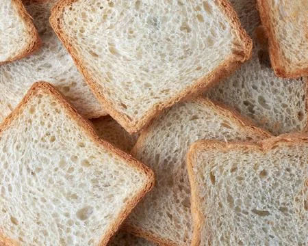 Slices of white bread, full frame background Stock Photos