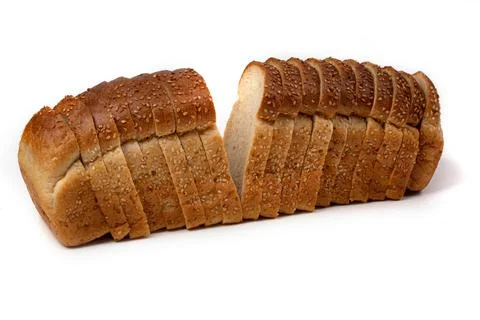 Slices of white bread or a loaf with sesame seeds isolated on a white backgro Stock Photos