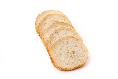 Slices of white bread or a loaf with sesame seeds isolated on a white backgro Stock Photos