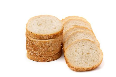 Slices of white bread or a loaf with sesame seeds isolated on a white backgro Stock Photos