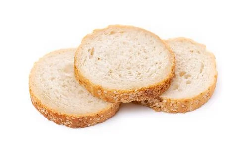 Slices of white bread or a loaf with sesame seeds isolated on a white backgro Stock Photos