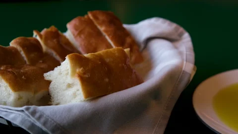 Slices of white bread on rustic wooden background Bread served on table in Stock Footage 303558085