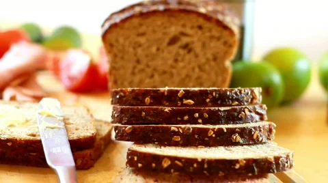 Slices whole grain bread, ham and vegetables, dolly shot Stock Footage 712976