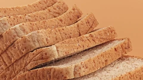 Slices of whole wheat bread. Panning shot. Stock Footage 310846339