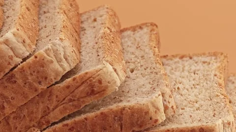 Slices of whole wheat bread. Zoom out. Stock Footage 310846321