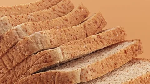 Slices of whole wheat bread. Zoom out. Stock Footage 310846337