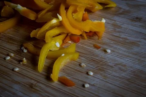 Slices of yellow pepper vegetable on a table. Healthy salad food Stock Photos