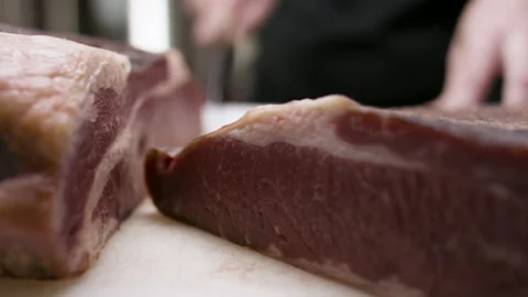 Slicing and presenting a perfect dry-aged beef brisket. Stock Footage 134501086