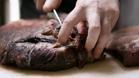 Slicing and presenting a perfect dry-aged beef brisket. Stock Footage 134501482