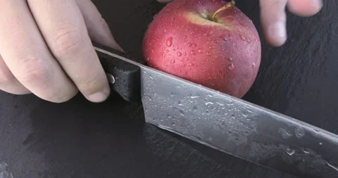 Slicing apple on chopping board Stock Footage 114839477