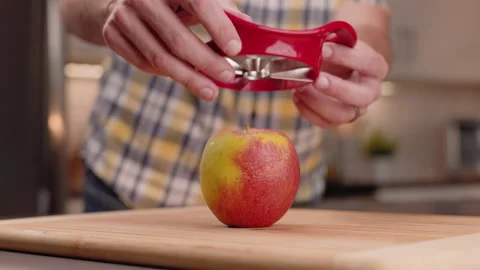 Slicing an Apple with a Wedge Slicer Stock Footage 155110099