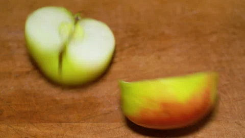 Slicing Apples on a cutting board Stock Footage 249597750