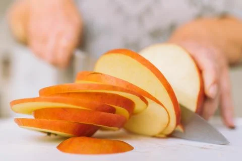 Slicing apples into slices Stock Photos