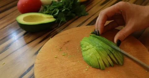 Slicing avocado, close-up 스톡 동영상 244423145