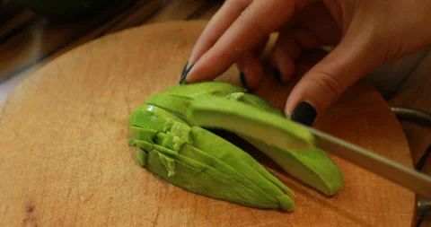 Slicing avocado, close-up Stock Footage 244425726