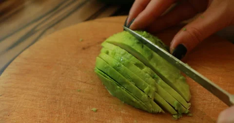 Slicing avocado, close-up Stock Footage 244425749