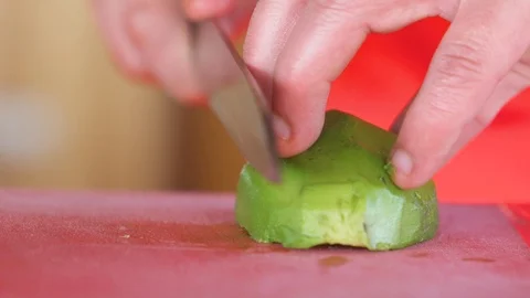 Slicing an avocado Stock Footage 90297371