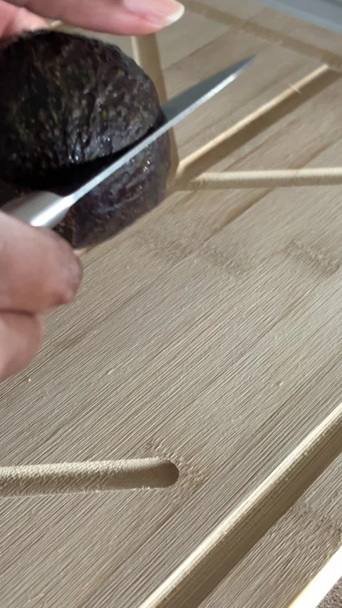 Slicing an avocado Stock Footage 312717833