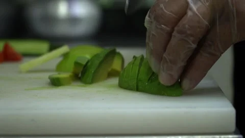 Slicing Avocado in Kitchen Stock Footage 319207770