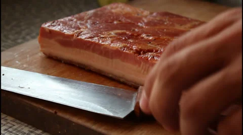 Slicing bacon Stock Footage 31022360