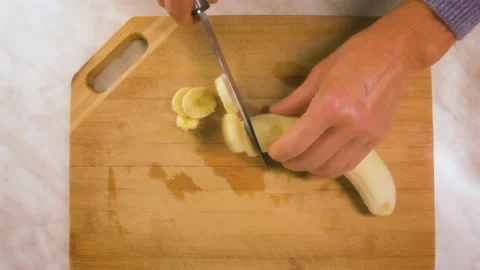 Slicing a banana Stock Footage 162129999