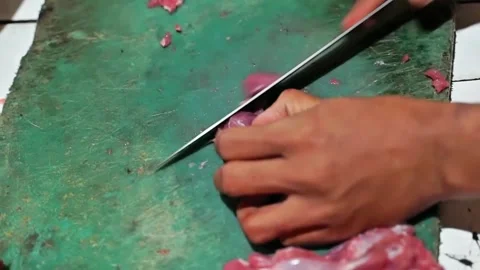 Slicing beef into small pieces for beef satay Stock Footage 273041672
