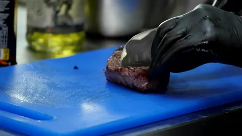 Slicing Beef Steak on a Board Stock Footage 132167015