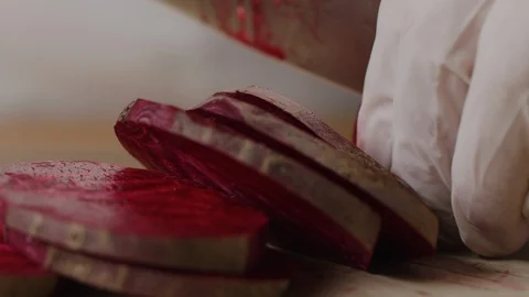 Slicing beet with chef knife macro shot, preparing ingredients for Tar Tar 스톡 동영상 128489974