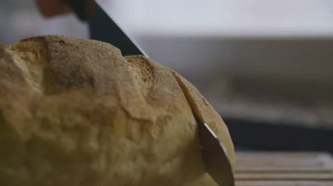 Slicing bread in slow motion Stock Footage 57638857