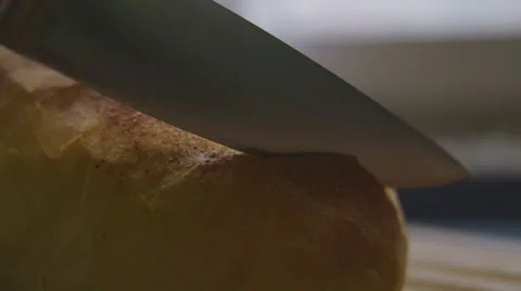 Slicing bread in slow motion Stock Footage 57638884