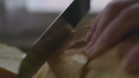 Slicing bread in slow motion Stock Footage 57638941