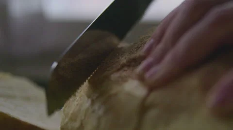 Slicing bread in slow motion Stock Footage 57639171