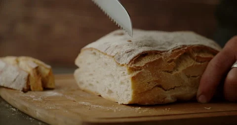 Slicing bread in Super Slow motion 1000 fps Stock Footage 161799104
