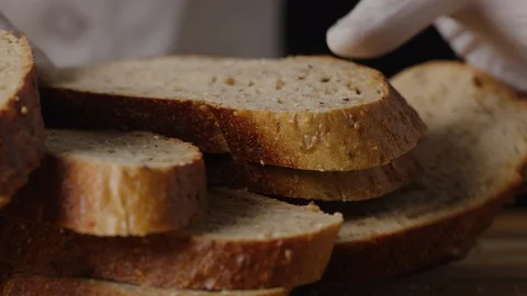 Slicing brown bread macro shot Video stock 128486142