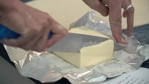 Slicing Butter in the Kitchen Stock Footage 317472572