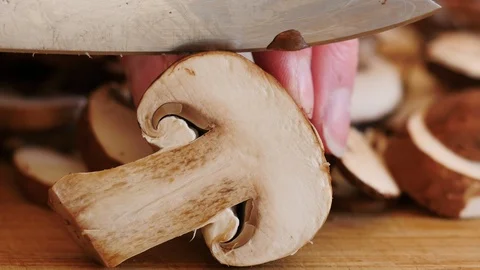 Slicing Button Portabella Mushrooms Stock Footage 125637799
