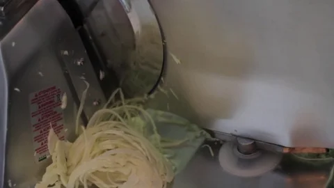 Slicing cabbage with machine Video stock 80735179