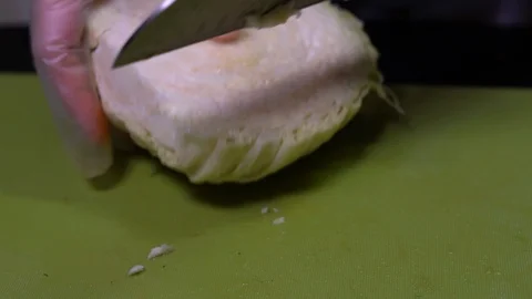 Slicing cabbage vegetable to prepare for cooking Stock Footage 111329501