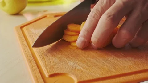 Slicing carrot with a knife. Stock Footage 136726355