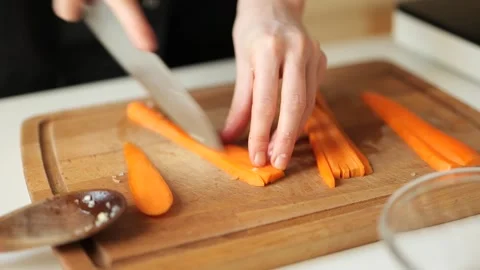 Slicing carrots Stock Footage 203896114