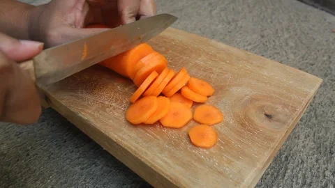 Slicing carrots Stock Footage 242171190