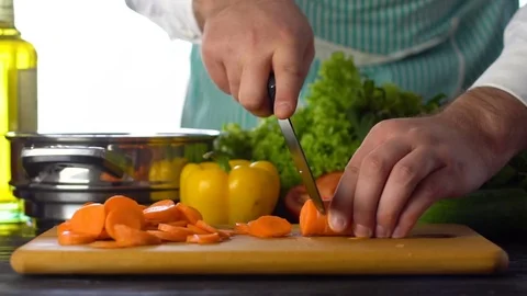 Slicing carrots with a knife Stock-Footage 85227321