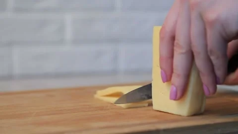 SLICING CHEESE Stock Footage 155653575