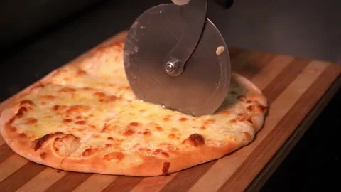 Slicing a Cheese Pizza Stock Footage 319207361