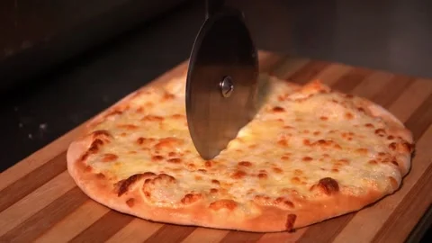 Slicing a Cheese Pizza Stock Footage 319207368