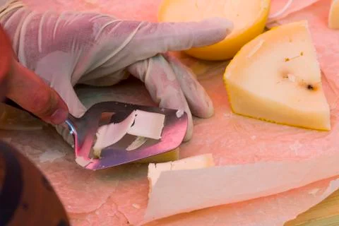 Slicing cheese for tasting Stock Photos