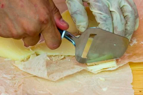 Slicing cheese for tasting Stock Photos