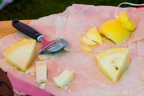 Slicing cheese for tasting Stock Photos
