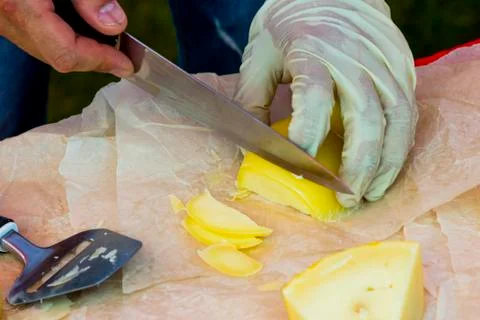 Slicing cheese for tasting Stock Photos