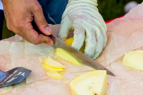 Slicing cheese for tasting Stock Photos